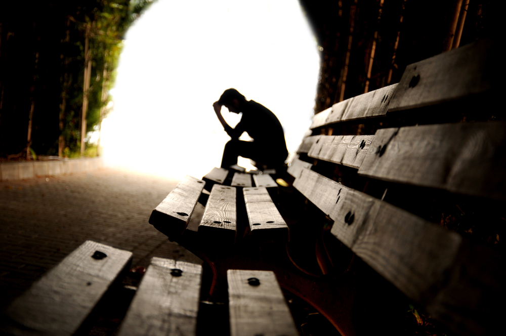 social anxiety man on park bench